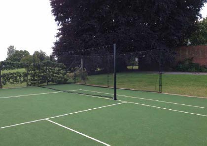 Cricket net as part of tennis court by EnTC courts.