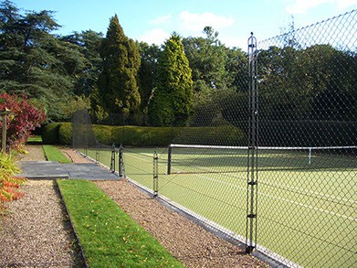 EnTC Tennis Courts replacing hedges with fences encourages air flow and keeps the court dry.