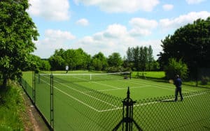 Superb Savanna tennis court surface with obelisk tennis court fencing from Elliott Courts.