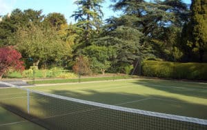 Tennis court fencing from EnTC merges into a green background